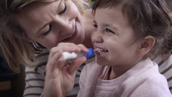 Young child gets cheek swab my mother